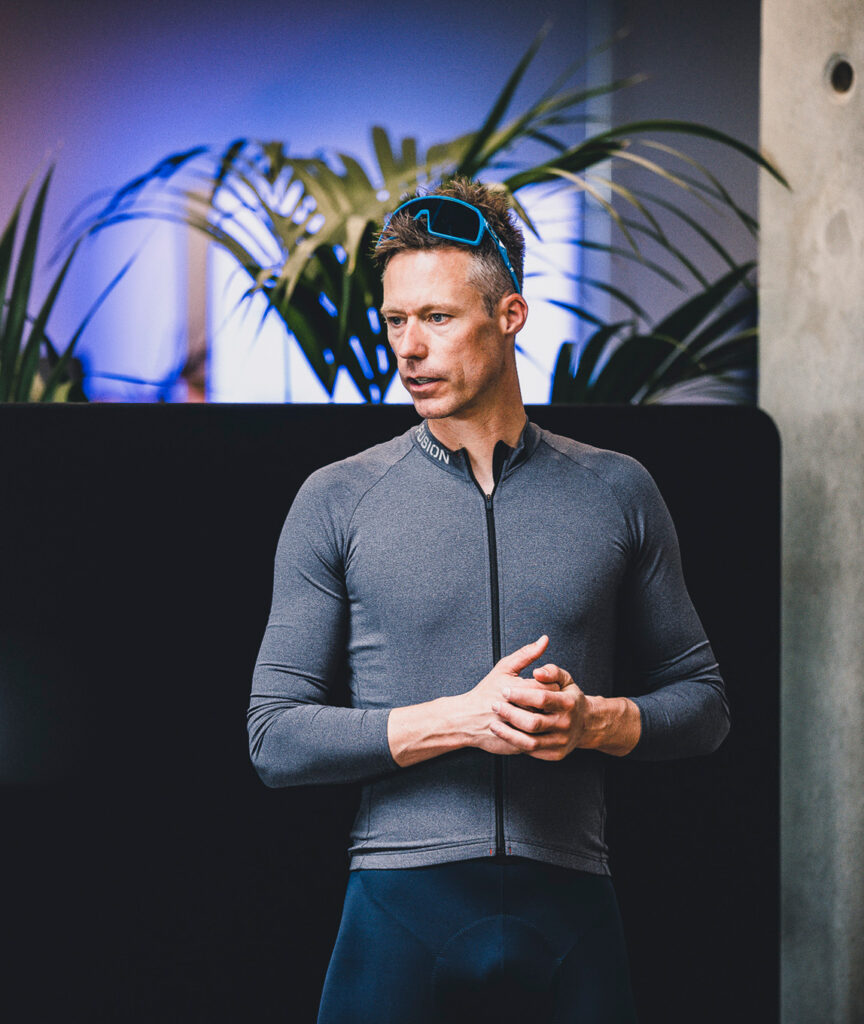 Man with sports googles in his hair wearing FUSION cycling clothes