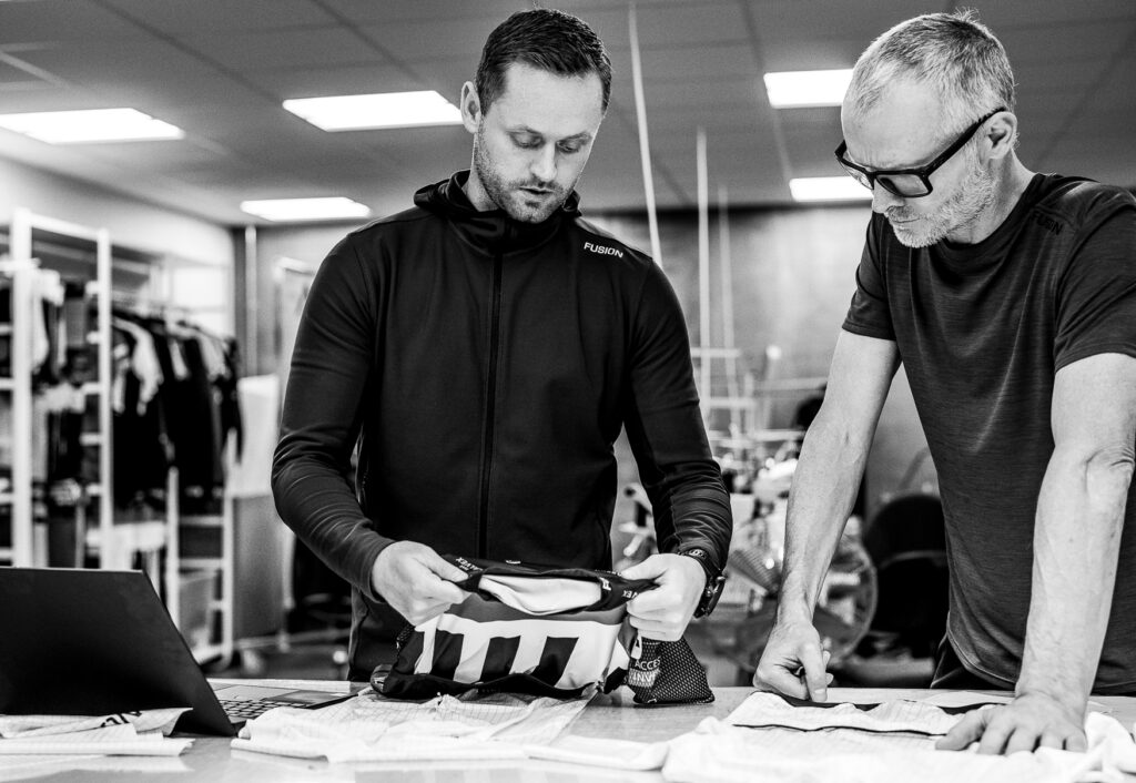 black and white photo with men viewing sports clothes from FUSION