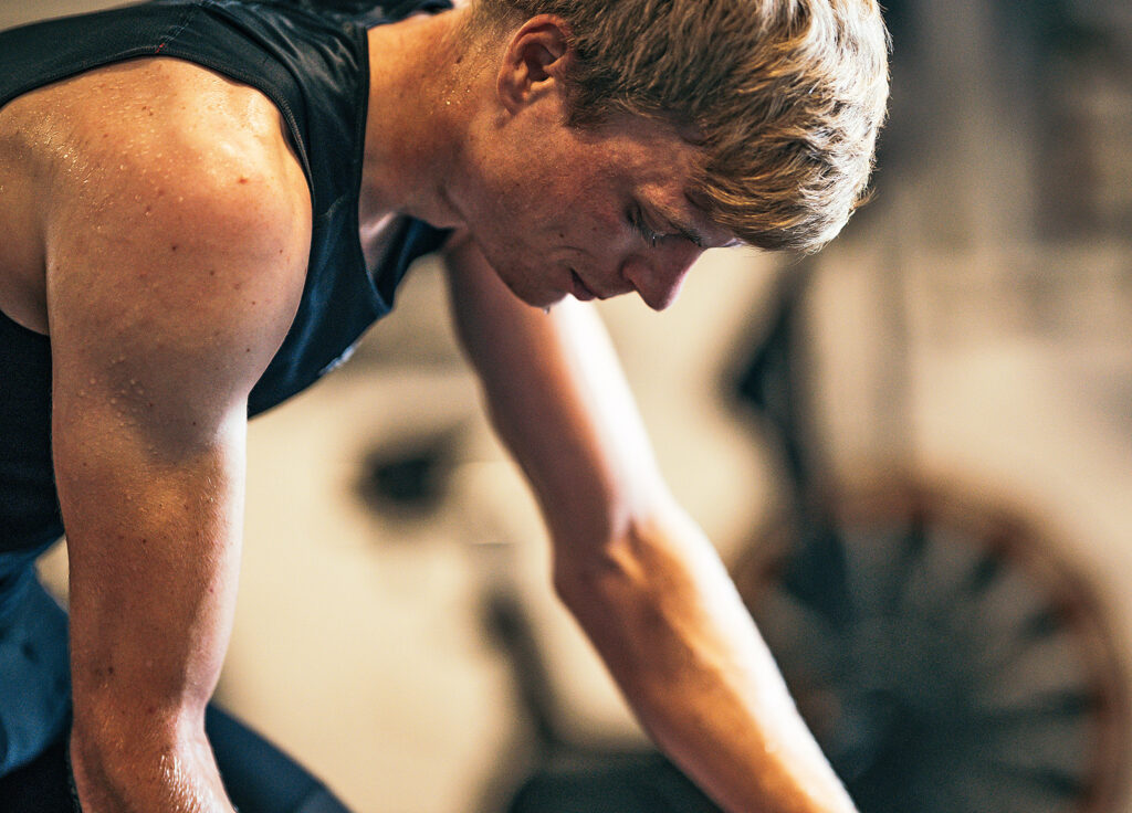 Closeup of man working out drops of sweat on his arms and from his chin